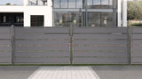 Grauer Sichtschutzzaun aus Aluminium Latten vor einem Haus